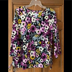 Comfy fabric, 95 cotton 5 spandex. Decorative side ties at bottom.